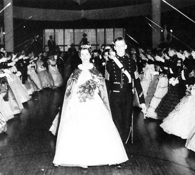 Larry Wiest with the Queen of the Prom.  Whats that in his hand -- his crown?